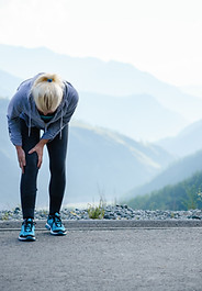 Runner stretching knee